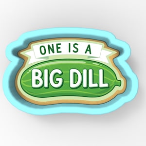 May include: A light blue cookie cutter in the shape of a pickle with the text "ONE IS A BIG DILL" in white. The pickle is green with a light brown border.