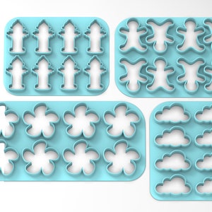 May include: Set of four blue plastic cookie cutters. The cutters are arranged in two rows of two. The top row features fire hydrants, the second row features gingerbread people, the third row features flowers, and the bottom row features clouds.