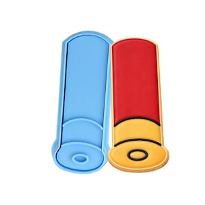 May include: A blue cookie cutter and a decorated cookie in the shape of a shotgun shell. The cookie has a red top, yellow middle, and a black and yellow bottom. The cookie cutter is light blue.