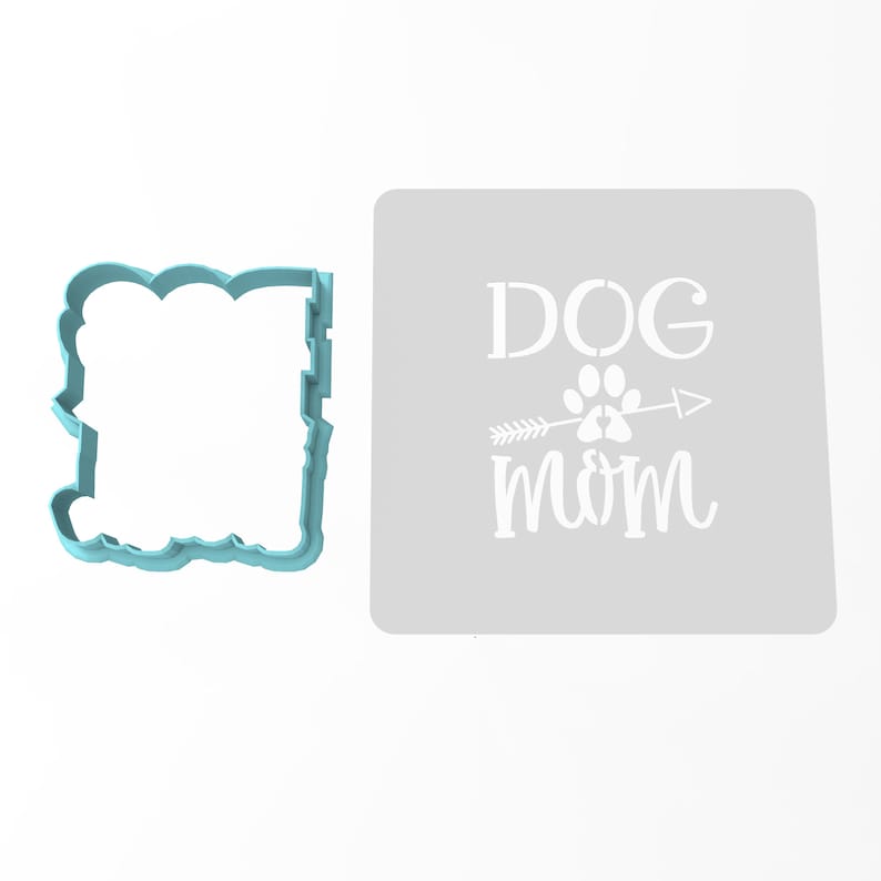 May include: A light blue plastic stencil with the words "DOG MOM" and a paw print with an arrow through it. The stencil is on a white background.