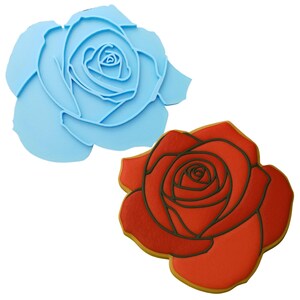 two cookie cutters with a red rose on one and a blue rose on the
