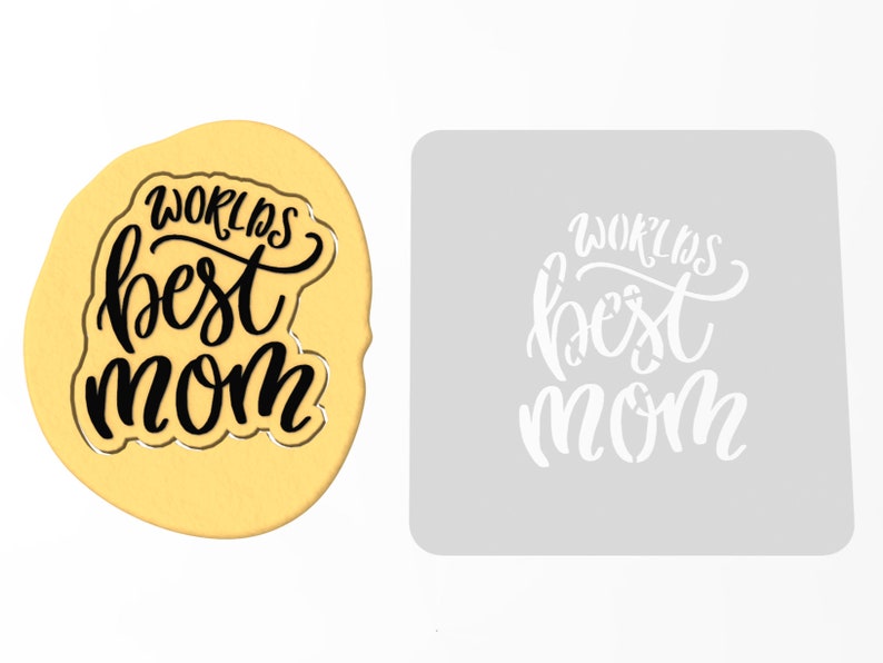 May include: A white stencil with the text "World's Best Mom" in black lettering. The stencil is on a gray background.