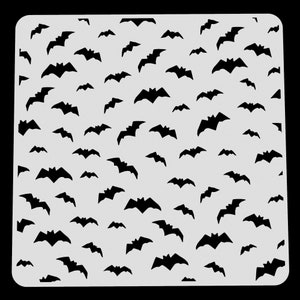 May include: A white stencil featuring a repeating pattern of black bats. The stencil is designed for crafting and decorating.