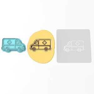 May include: A blue plastic cookie cutter shaped like an ambulance with a white cross on the side. The cutter is shown on a yellow surface and a gray surface with a white outline of the ambulance.