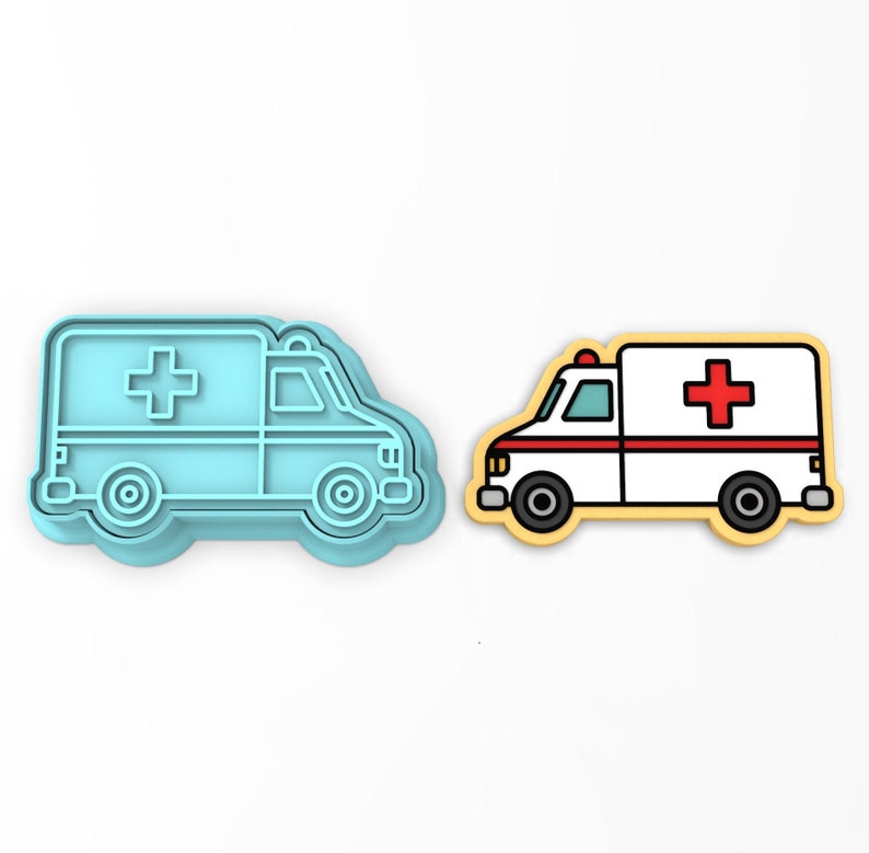 May include: A blue plastic cookie cutter shaped like an ambulance with a red cross on the side. Next to it is a yellow cookie with a white ambulance design and a red cross.