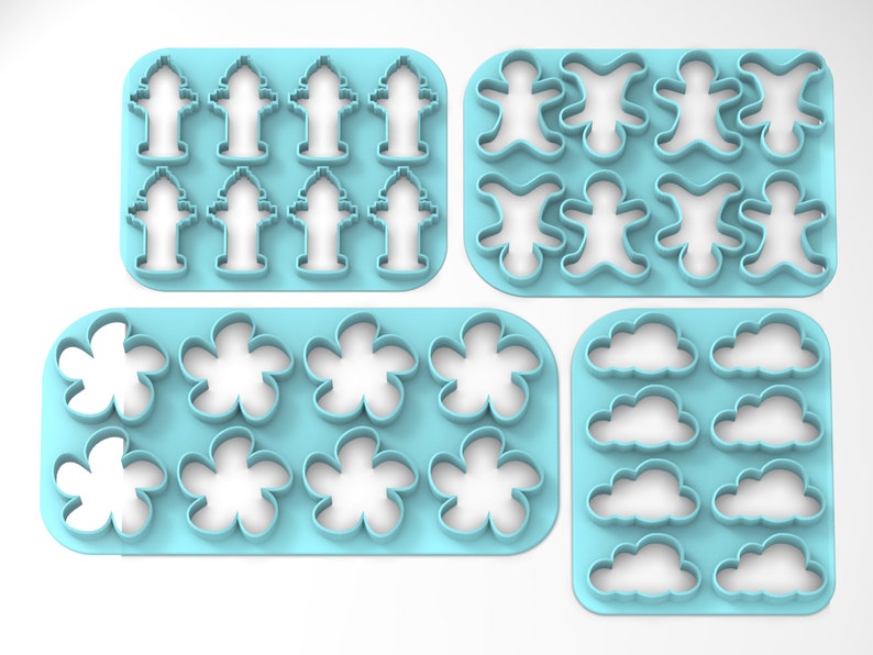 K&ouml;nnte beinhalten: Satz mit sechs blauen Plastik-Ausstechern. Die Ausstecher sind in Form von Hydranten, Lebkuchenm&auml;nnern, Blumen und Wolken.