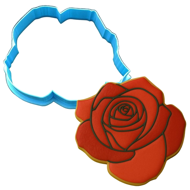 a cookie cutter with a red rose on it