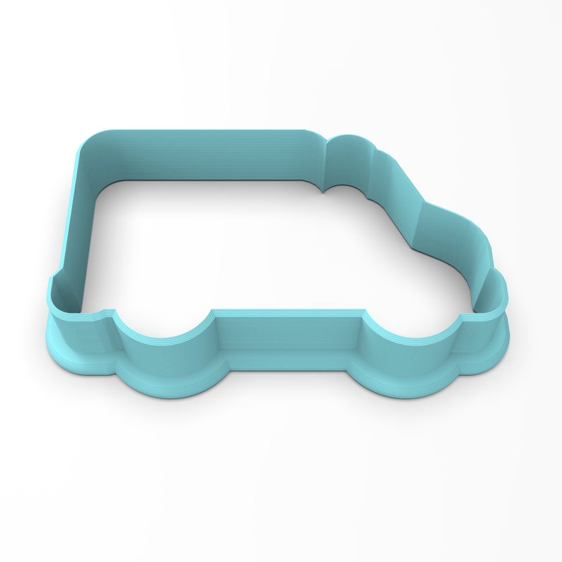 May include: A light blue plastic cookie cutter shaped like a van. The cutter has a rounded front and back, and a flat bottom.