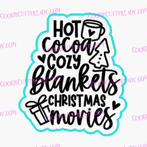 May include: Black and white graphic design with the text "Hot Cocoa Cozy Blankets Christmas Movies". The design includes a mug, a Christmas tree, a gift box, and hearts.
