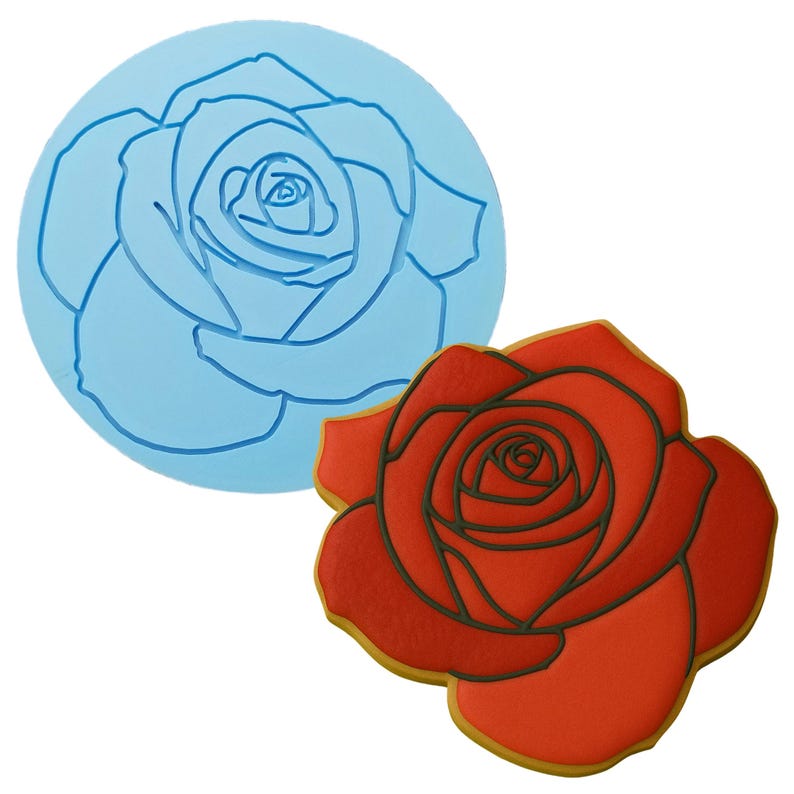 two cookie cutters with a rose design on them