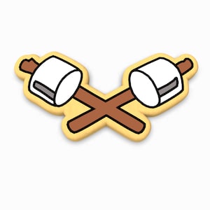 May include: Two white marshmallows on brown sticks, crossed over each other, with a yellow background.