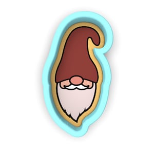 May include: A blue plastic cookie cutter shaped like a gnome with a red hat, white beard, and brown eyes.