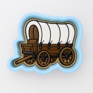 May include: A light blue cookie cutter shaped like a covered wagon. The design features a brown wooden wagon body with black wheels and a white arched canvas top. The cutter has a thick, light blue plastic frame that outlines the wagon shape.