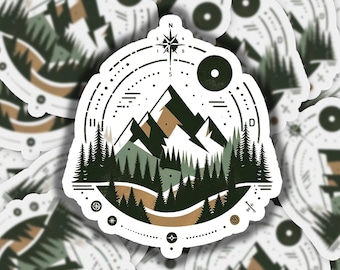 May include: A sticker featuring a mountain range and forest scene within a compass-like design. The illustration uses shades of green, brown, and white. A compass rose is at the top, and the design includes dotted lines and other geometric elements.