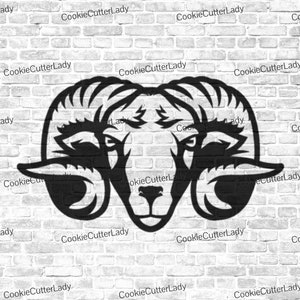May include: Black and white silhouette of a ram's head with large horns. The image is on a white brick background.