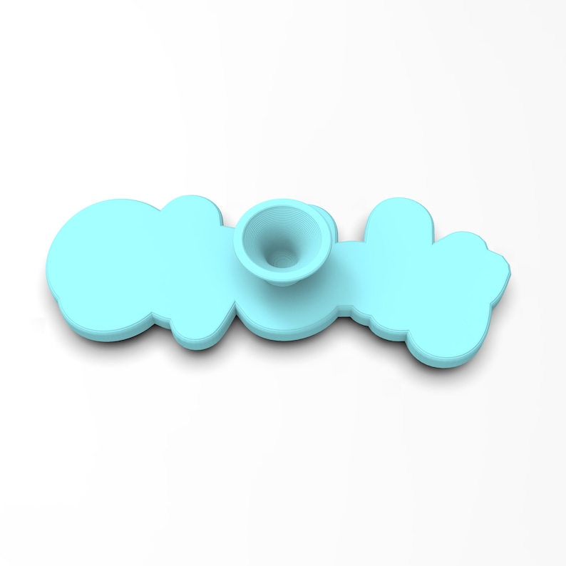 May include: A light blue plastic phone grip with a suction cup on the back. The grip is shaped like the word "cool" in a cartoon font.