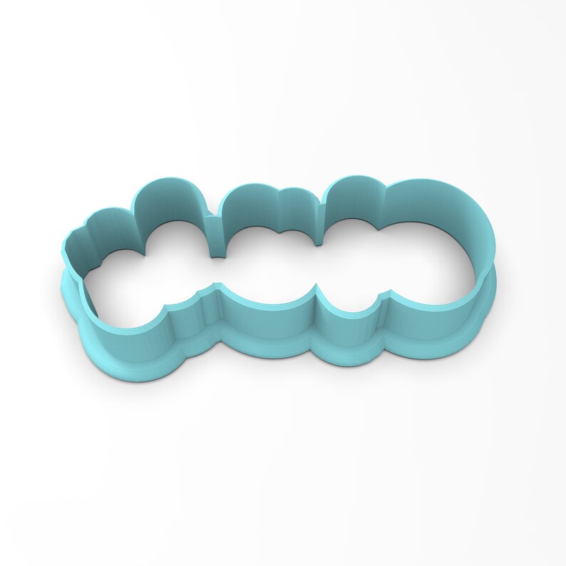 May include: A light blue plastic cookie cutter shaped like the word "LOVE" in a whimsical font.