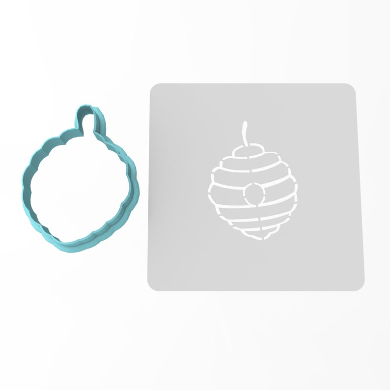 May include: A light blue plastic cookie cutter shaped like a honeycomb, and a white stencil of a honeycomb on a gray background.