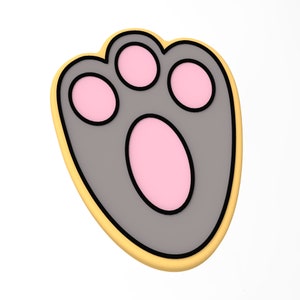 May include: A gray paw print cookie with pink accents and a yellow outline.