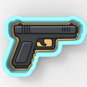 May include: A black handgun-shaped cookie cutter with a gold outline and a light blue border. The cookie cutter has a detailed design of a pistol, including the trigger, handle, and slide.