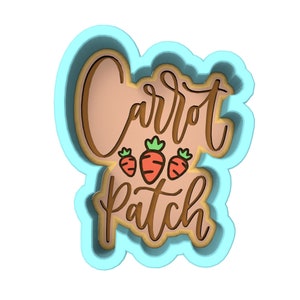 May include: A blue and brown cookie cutter with the text "Carrot Patch" and three small carrots.