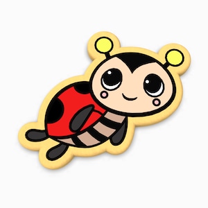 May include: A cartoon ladybug cookie with black spots, yellow antennae, and big eyes. The cookie is decorated with brown and white stripes.