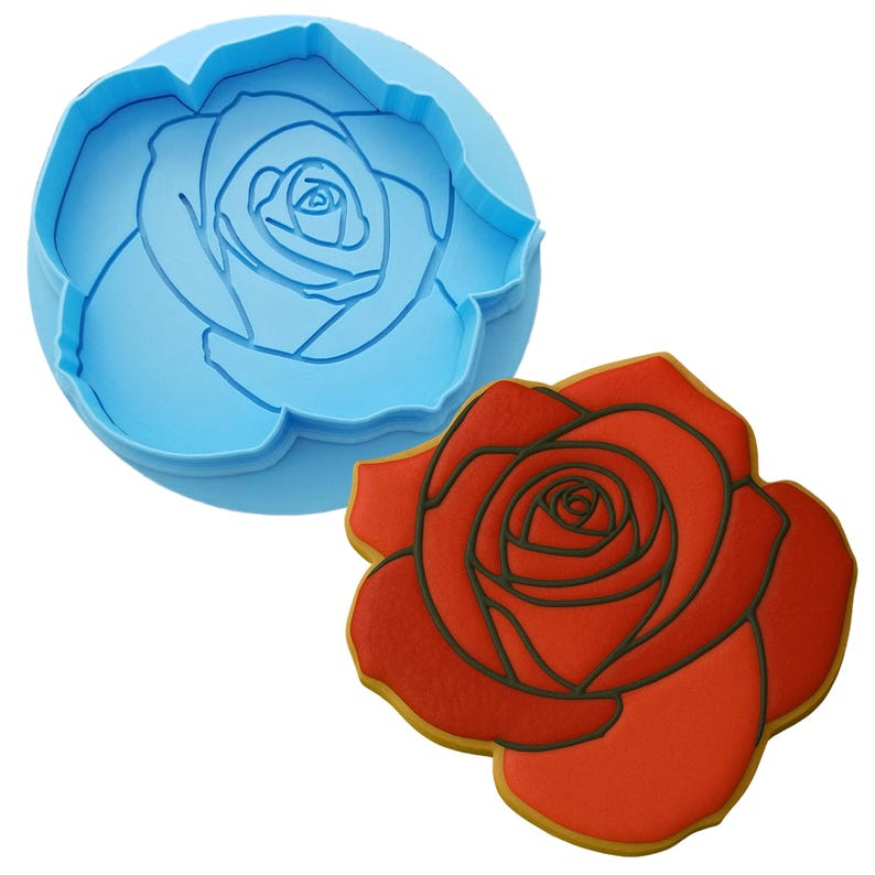 two cookie cutters with a rose design on them
