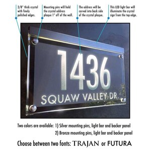 May include: A clear acrylic house number sign with the number 1436 and the street name "SQUAW VALLEY DR."  The sign is illuminated by an LED light bar.  The sign is available in two colors: silver or bronze.  The sign can be customized with two fonts: TRAJAN or FUTURA.