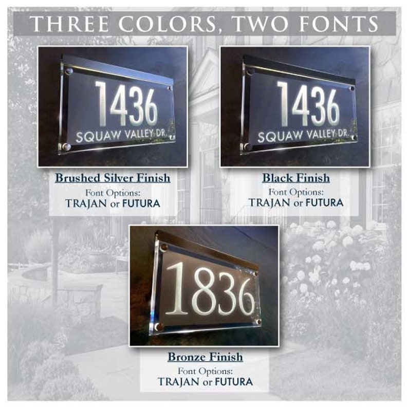 May include: Three house number signs with different finishes: brushed silver, black, and bronze. Each sign features the number "1436" or "1836" with the street name "SQUAW VALLEY DR." and the font options "TRAJAN or FUTURA".