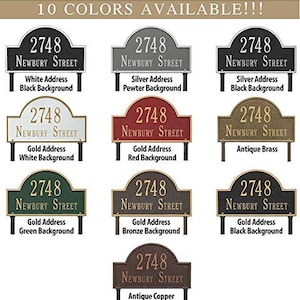 May include: Ten different color options for a house number plaque. The plaque is arched and says "2748 Newbury Street". The colors include white, silver, gold, red, green, bronze, antique copper, and black.