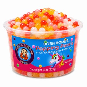 May include: A clear plastic container filled with multicolored popping pearls. The label reads BOBA BOMBS Popping Pearls, FRUIT EXPLOSION IN EVERY BITE, Rainbow, and Net weight 16 oz (453 g), featuring a Buddha Bubbles logo and a unicorn graphic.