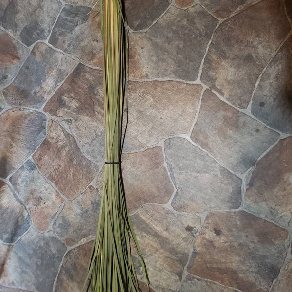 Dried cattail leaves for floral arrangements,  weaving,  baskets, chair bottoms, caning, and rush.