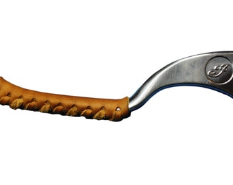 May include: A brown leather handlebar wrap with a braided design. The wrap is attached to a silver motorcycle brake lever with a logo that says "F".