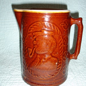 Stoneware Pitcher, Brown Salt Glaze, Man With Pipe on One Side and Windmill on Other w Nautical Details