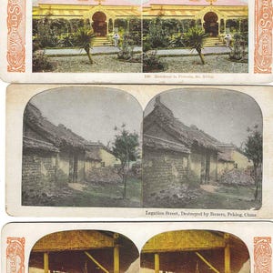 May include: A set of three vintage stereoscopic cards from the "World Series." The top card shows a residence in Pretoria, South Africa. The middle card depicts Legation Street in Peking, China, destroyed by Boxers. The bottom card shows a street scene.