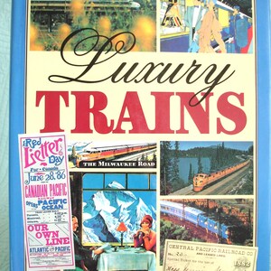 May include: A book cover titled "Luxury Trains" with various train images and text. The cover includes a collage of train scenes, a vintage ticket, and a "Red Letter Day" advertisement.