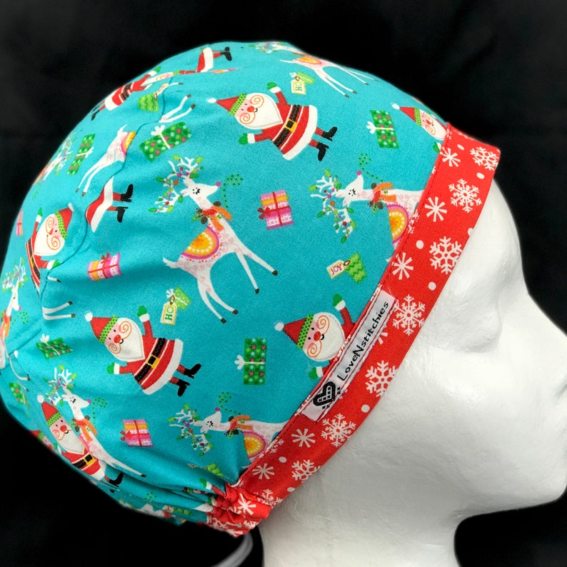 pink and blue santa hats