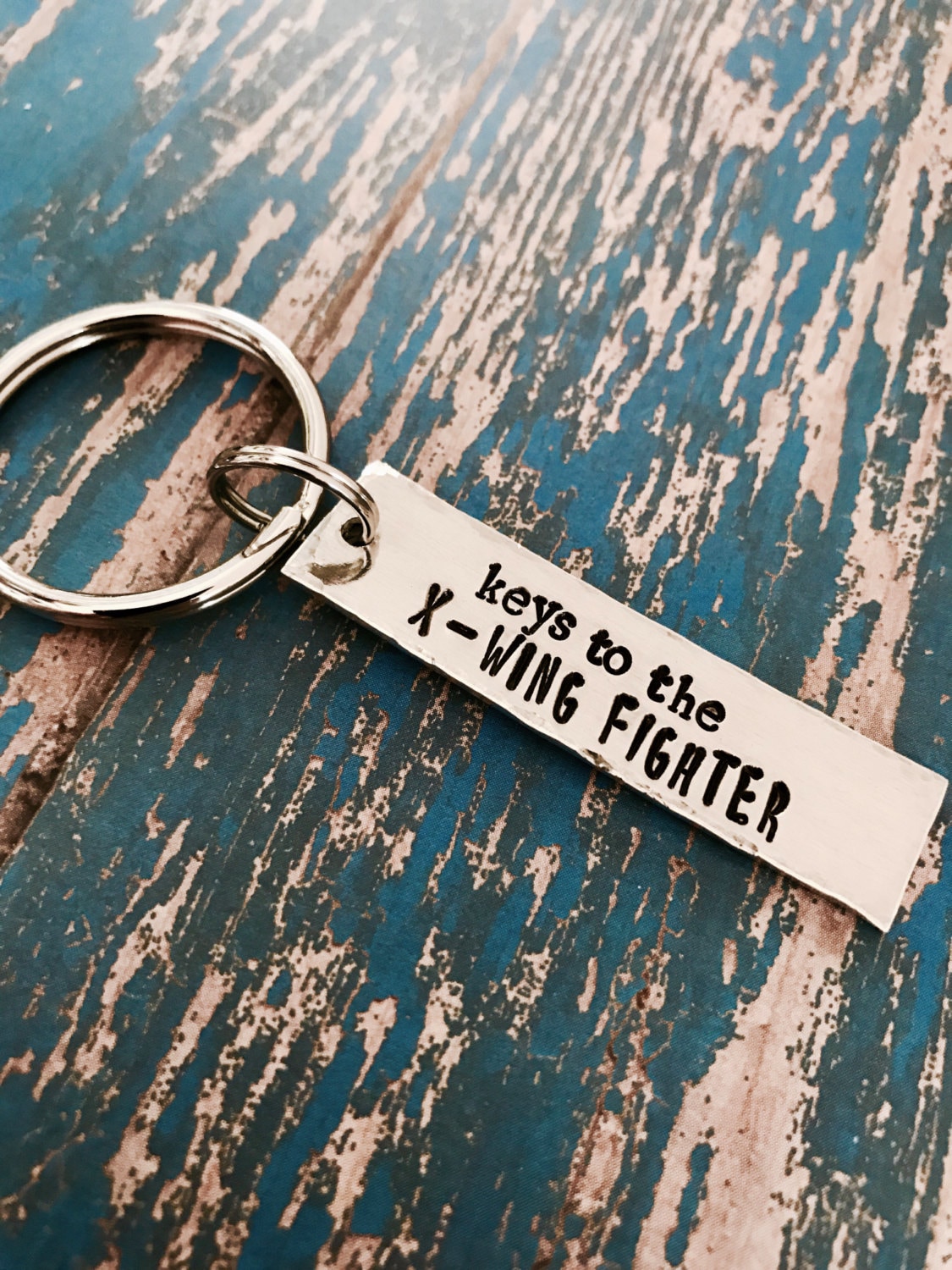 X clearance wing keychain