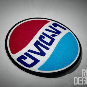 May include: A round, white patch with a blue and red design. The patch has the word "CIVIC" written in blue letters.