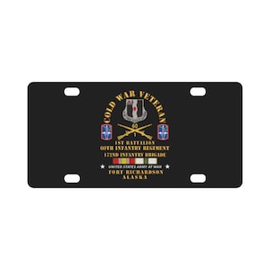May include: Black license plate featuring the text "Cold War Veteran" and military insignia. The plate includes the text "1st Battalion 60th Infantry Regiment 172nd Infantry Brigade" and "United States Army at War Fort Richardson Alaska."