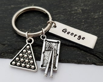May include: Silver keychain with a billiard ball rack charm, a pool cue charm, and a personalized name tag that says "George".