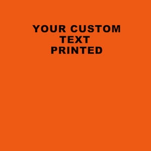 May include: Orange background with black text that reads "YOUR CUSTOM TEXT PRINTED"