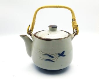 Vintage Japanese Blue and White Teapot with Rattan Handle