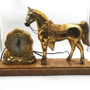 United Clock Corporation Brass Style/Color Horse Clock WORKS 11 1/2" Tall, 17" Wide