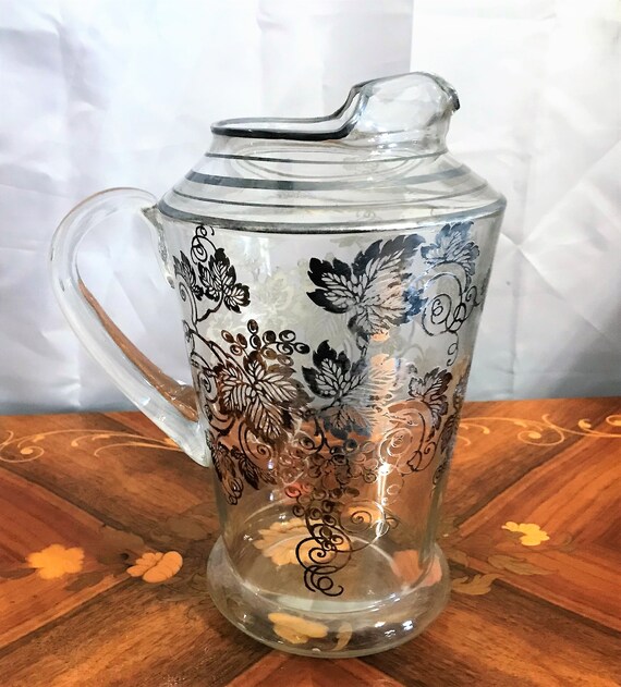 Antique Clear Glass Lidded Pitcher with Etched Grape Vine Motif