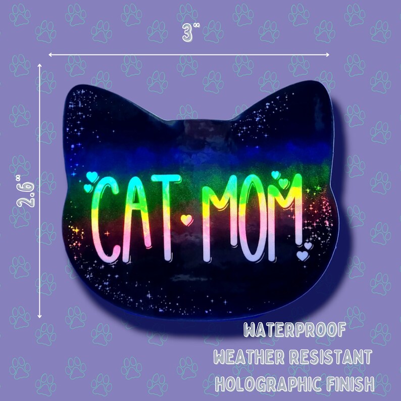May include: A holographic sticker with a black cat silhouette and the text "CAT MOM!" in rainbow colors. The sticker is 3 inches wide and 2.6 inches tall. It is waterproof, weather resistant, and has a holographic finish.