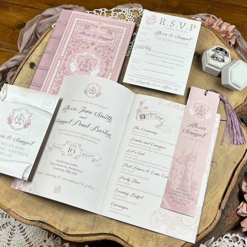 May include: A pink and white wedding invitation suite with a fairytale theme. The invitation features a castle illustration and the text "Alexis Jane Smith and Samuel Paul Burton". The RSVP card features the text "Alexis & Samuel The Next Chapter".