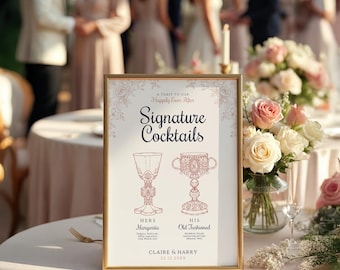 May include: A framed sign with gold trim displays "Signature Cocktails" for a wedding. The sign includes illustrations of a margarita and an old fashioned, with the names "Claire & Harry" and the date 22.12.20XX.