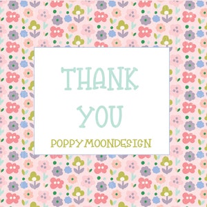 May include: A pink background with a white frame and the text "THANK YOU" in light blue. The text "POPPY MOONDESIGN" is in green below the text "THANK YOU". The background is covered in a pattern of small pink, blue, green, and white flowers.