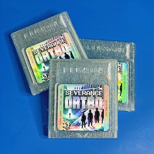Severance: ORTBO - Limited Edition Decorative Gameboy Color Cartridge - Translucent MDR Blue with Glitter - Woe’s Hollow Collectible